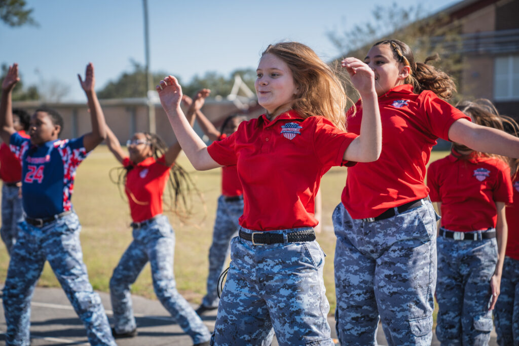 Joseph Stilwell Military Academy of Leadership students outside exercising on school track